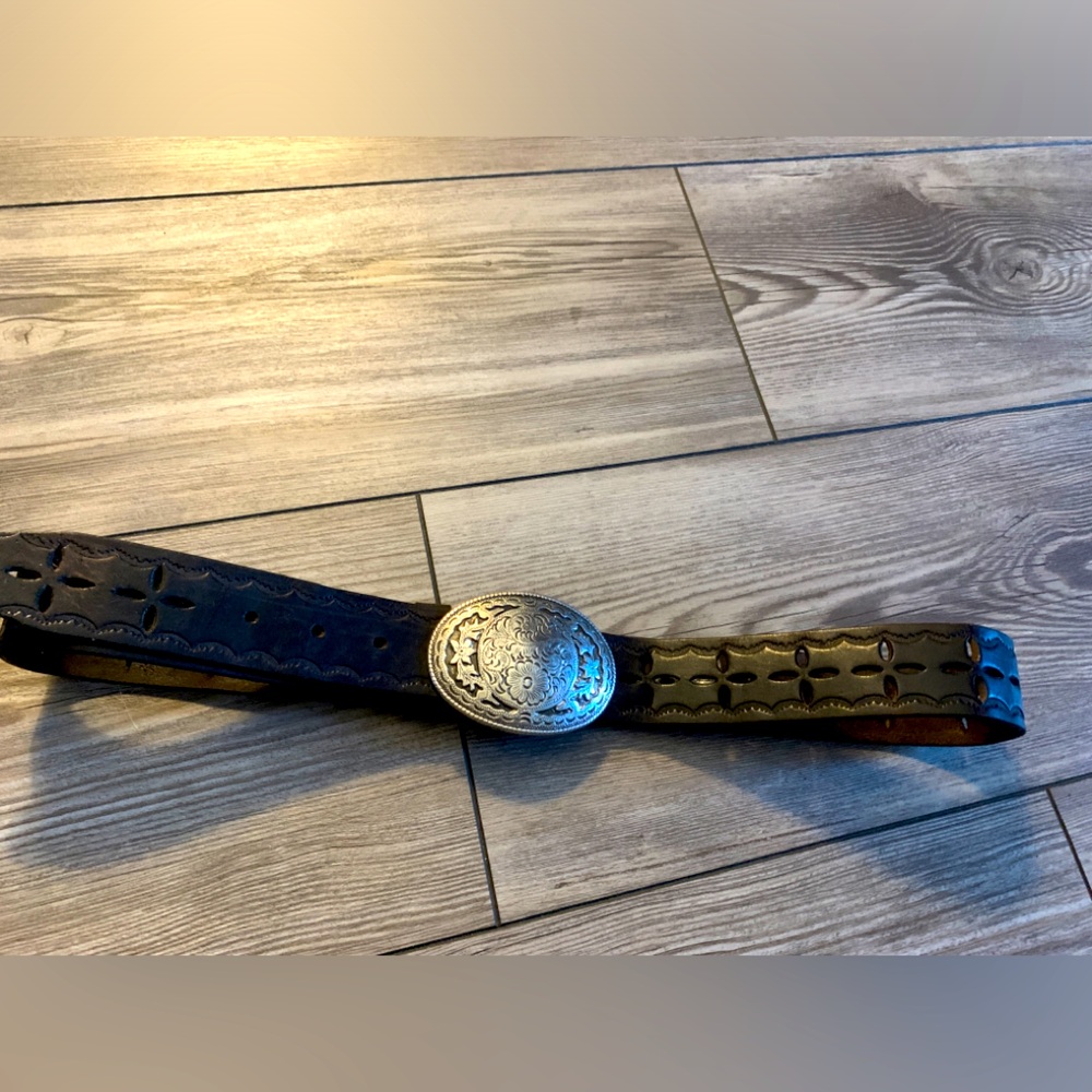 Hand made leather belt with silver plated buckle.